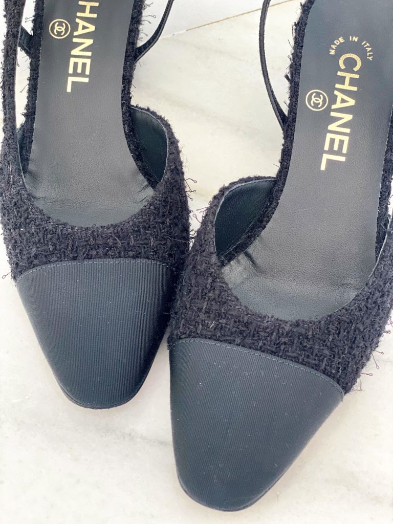Close-up of toe caps of Chanel slingback heels showing specs on the grosgrain