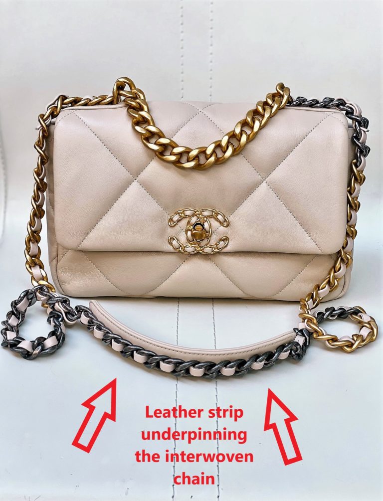 Photo showing leather reinforcement of the interwoven chain strap in Chanel bagof